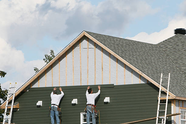 Professional Siding Installation technician working in Seattle, WA